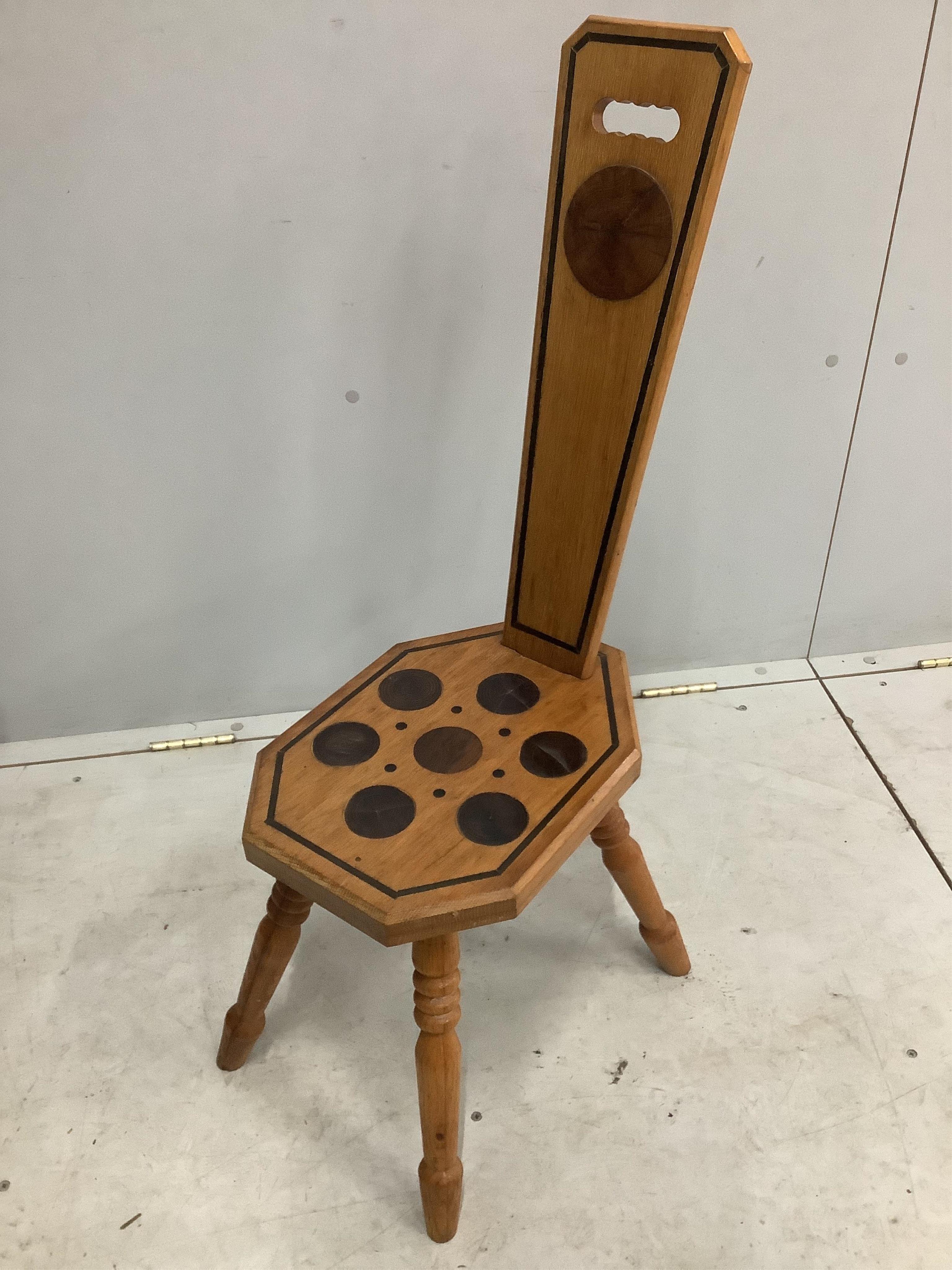 An early Victorian mahogany hall chair and a Continental inlaid oak spinning chair. Condition - both fair to good